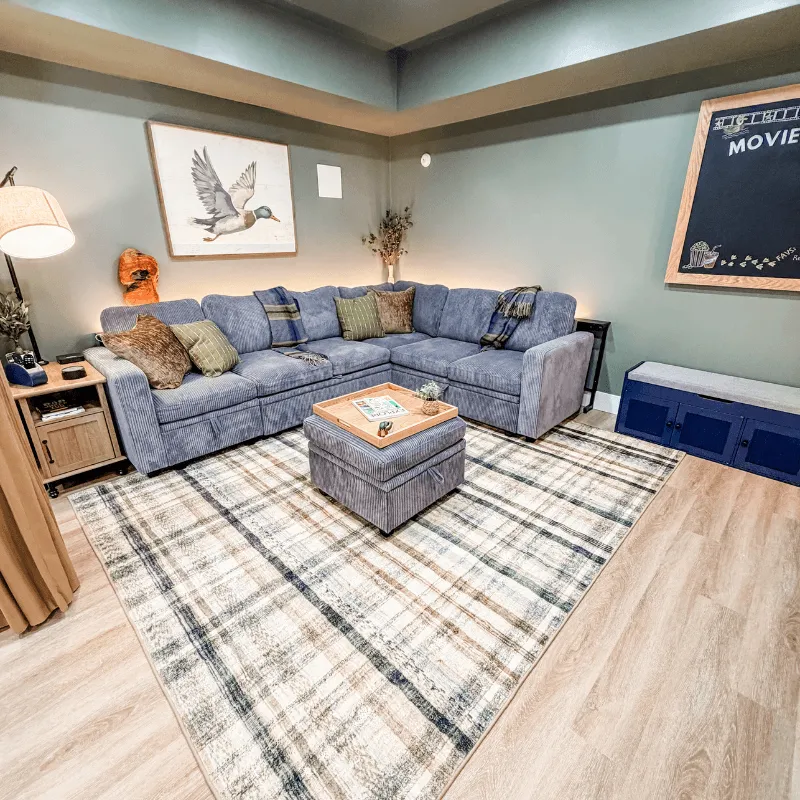 Ambient lighting and cozy theater setup in movie room at Mallards Nest on Lay Lake