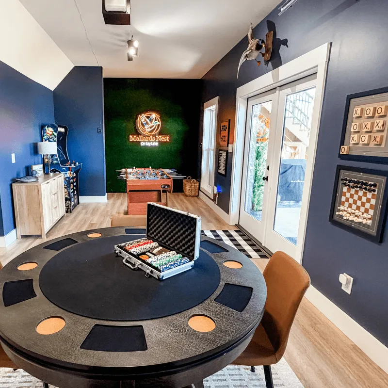 Game room at Mallards Nest on Lay Lake featuring poker table and seating for group entertainment
