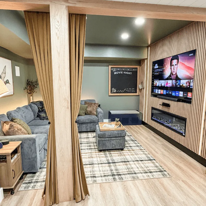 Private movie theater room with large screen and fireplace at Mallards Nest on Lay Lake