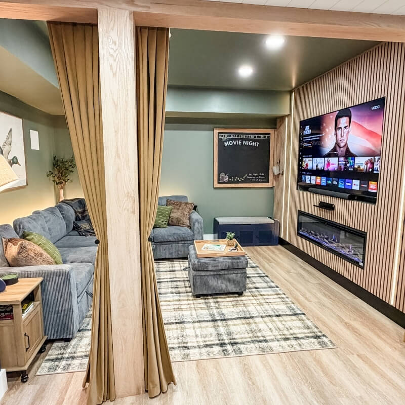 Spacious movie room with sleeper sectional sofa and cozy seating area at Mallards Nest on Lay Lake