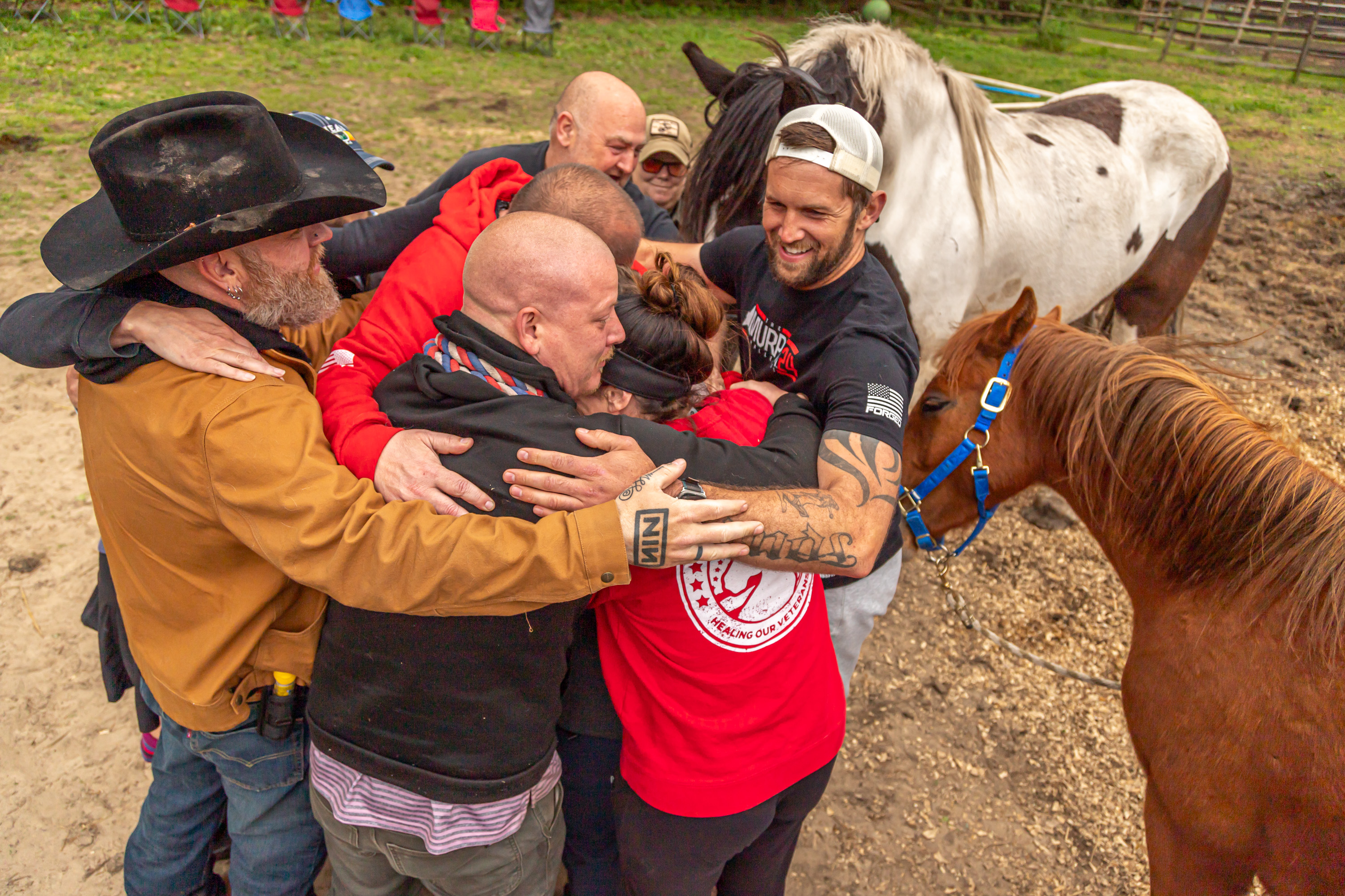 People gathered in a room, some interacting.