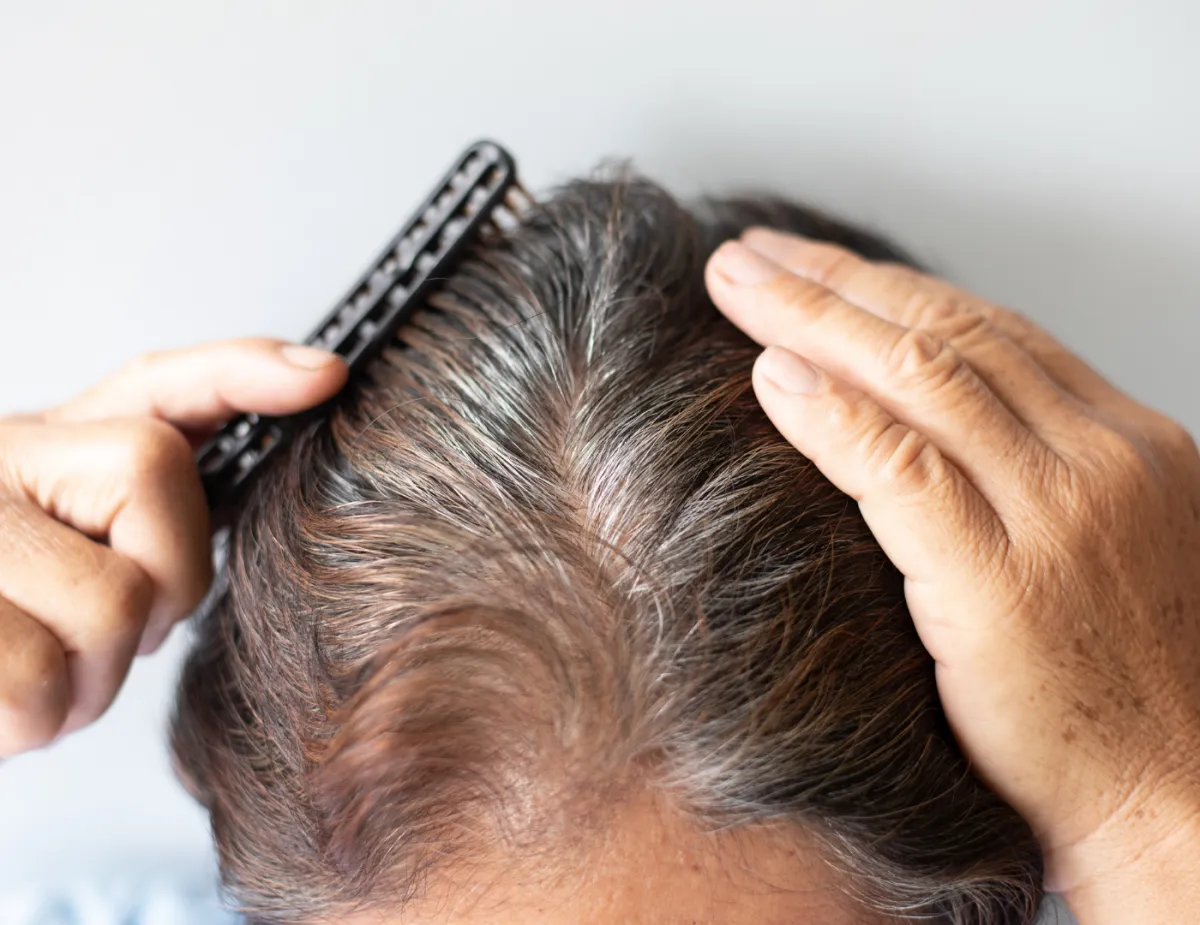 woman holding hair dryer