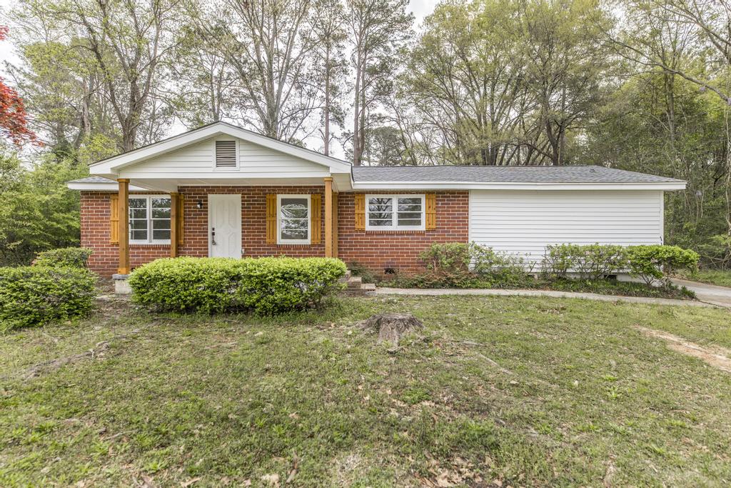 We Buy Houses in Perry GA. Renovated brick ranch with covered front patio.