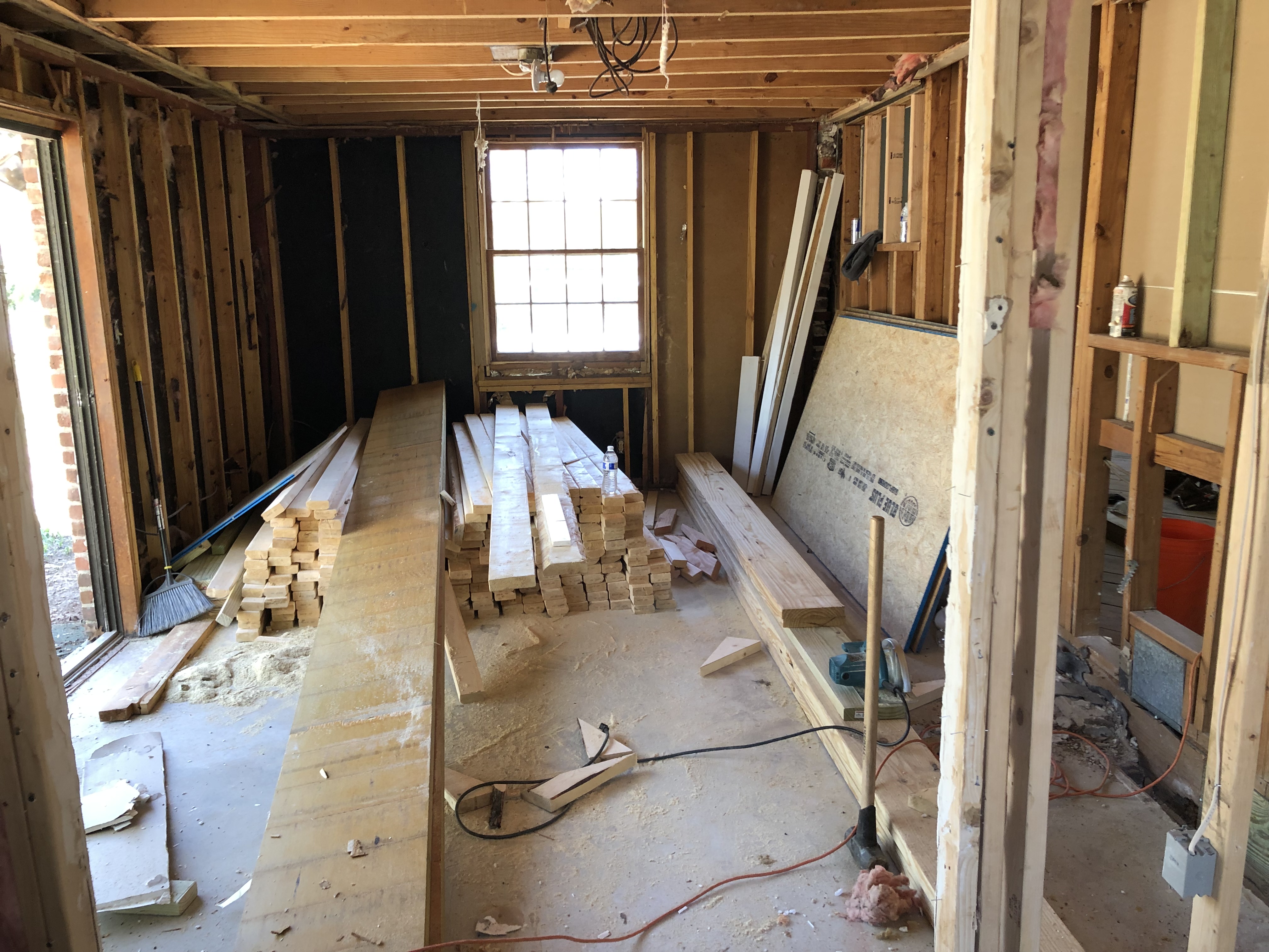 Sell my house fast in Perry GA. Inside of living room getting new subfloor, new insulation and framing.