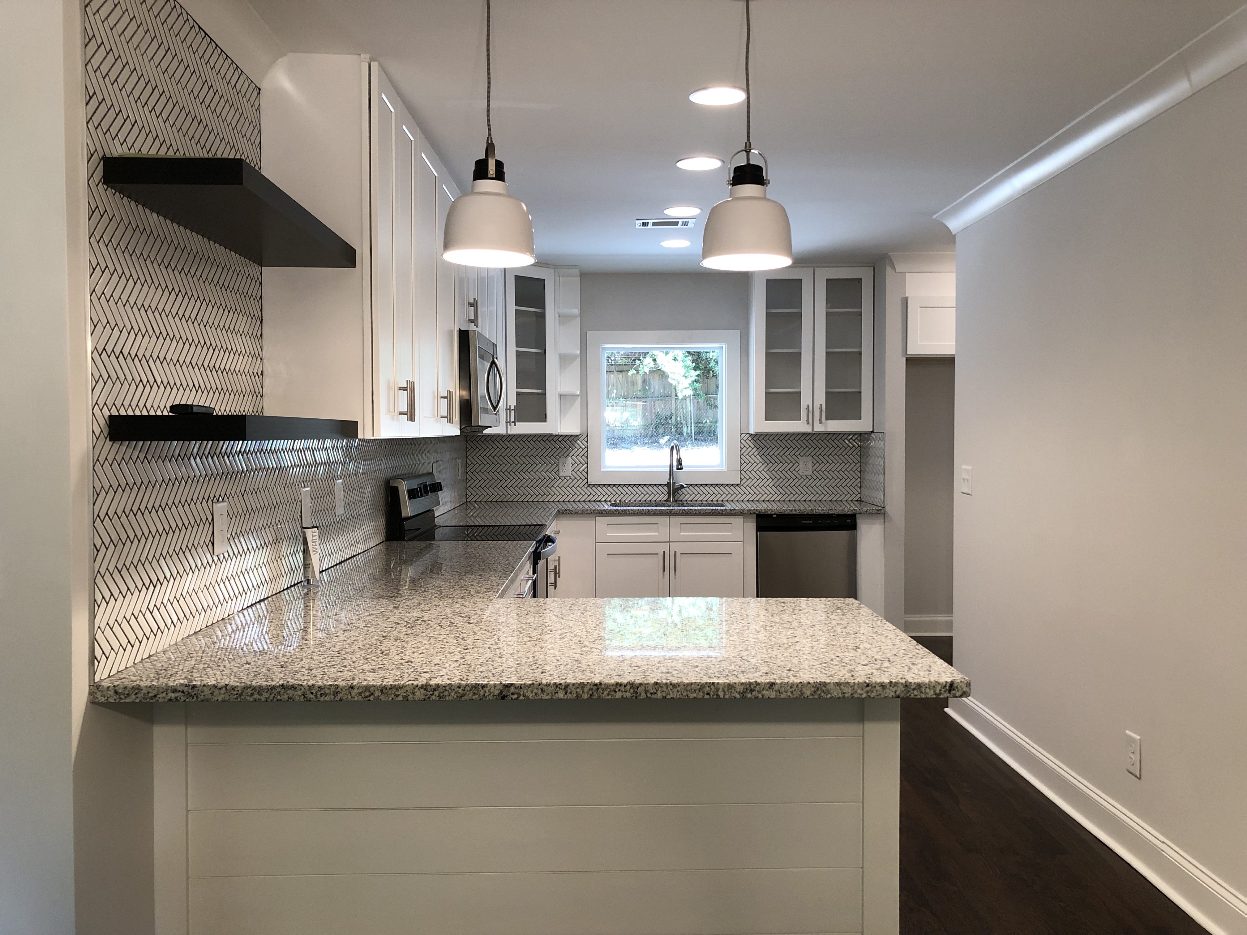 Sell my house cash in Perry GA. Renovated kitchen with new cabinets, new countertops, new appliances.