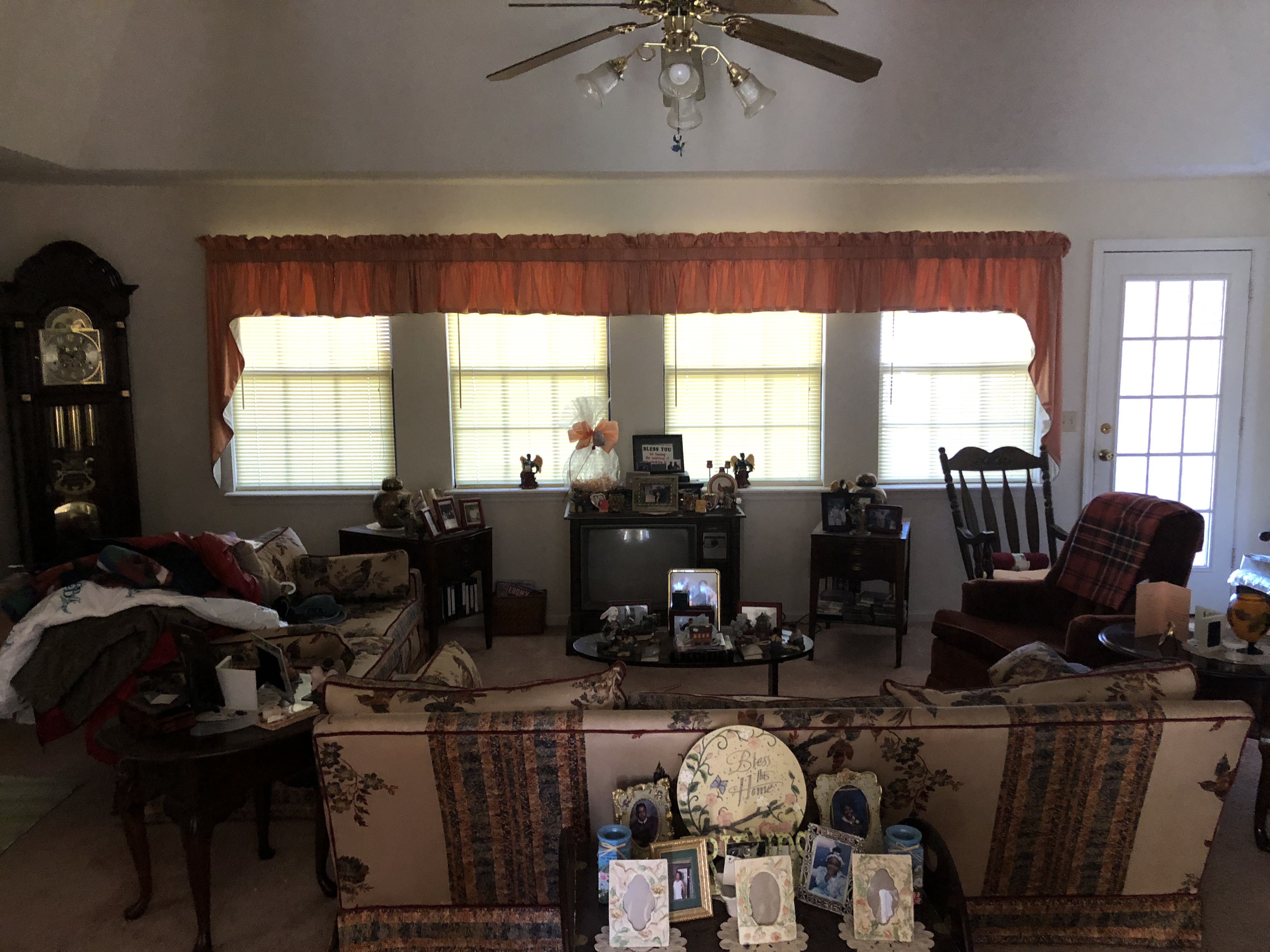 Sell a vacant house that is costing you money. Outdated living room filled with moldy furniture.JPG