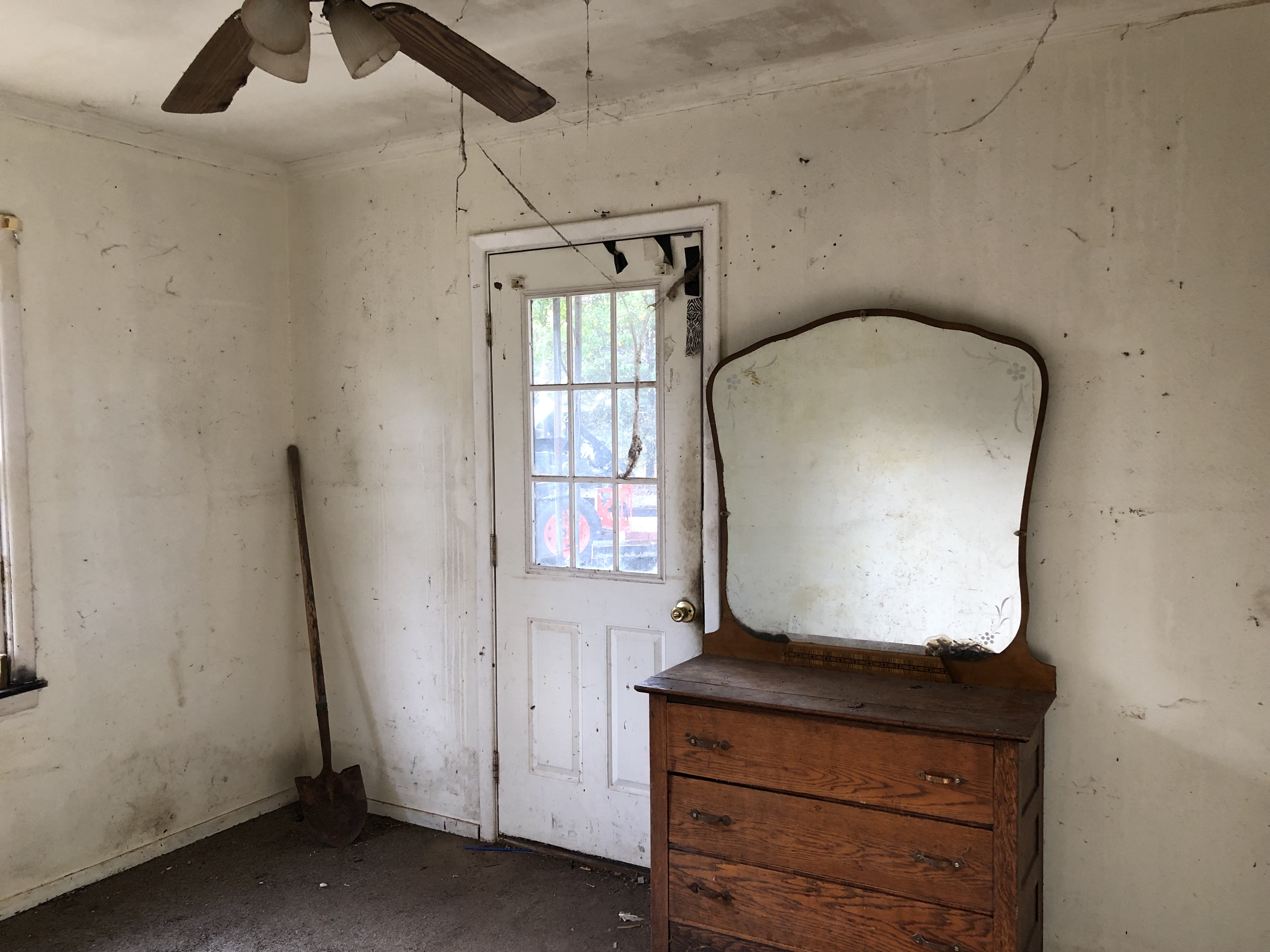 We buy Vacant houses, inherited empty house. Room covered in grime and spider webs.