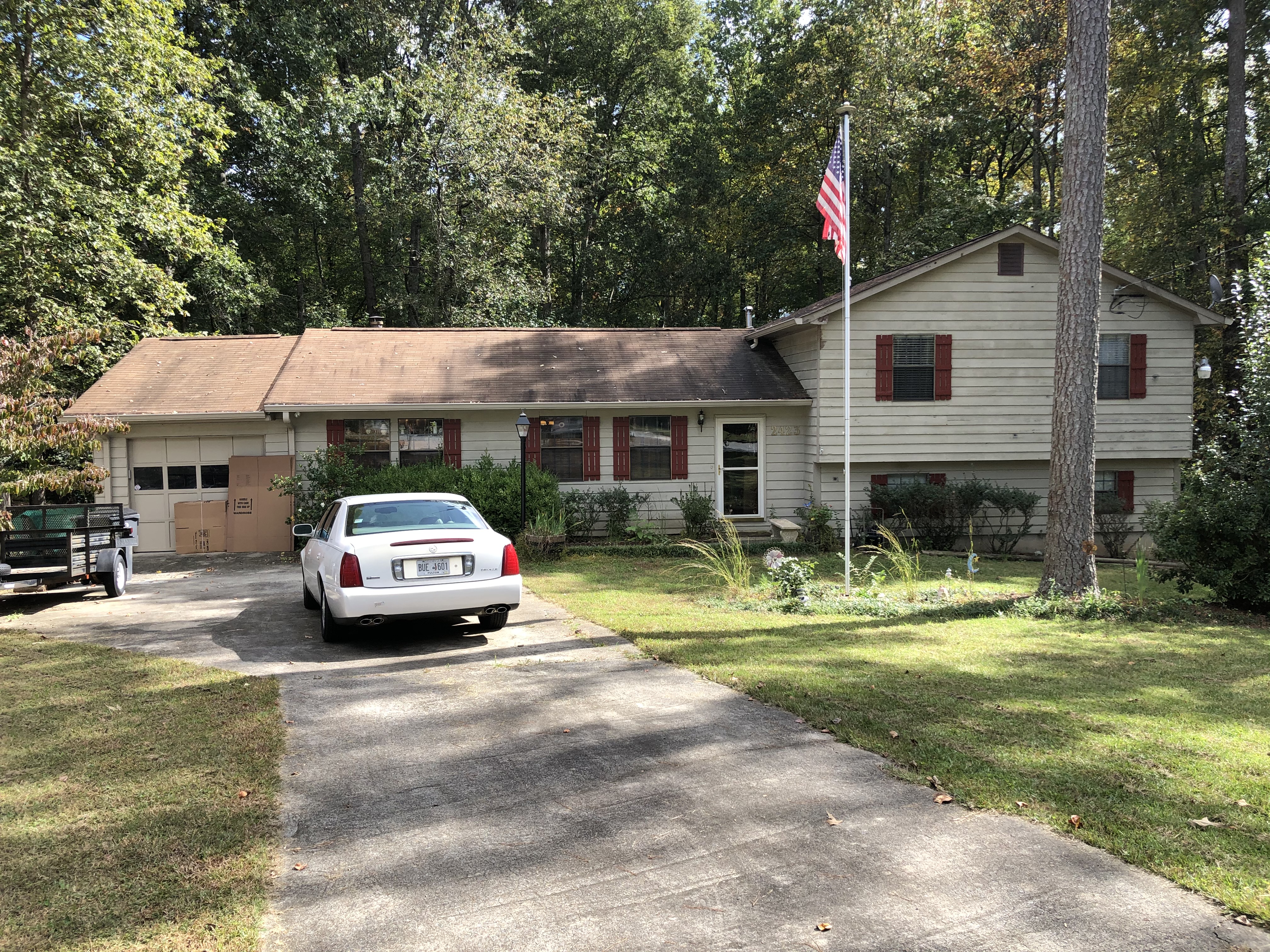 Stop Foreclosure in Georgia. Front of cedar siding house that needs fixing and painting.