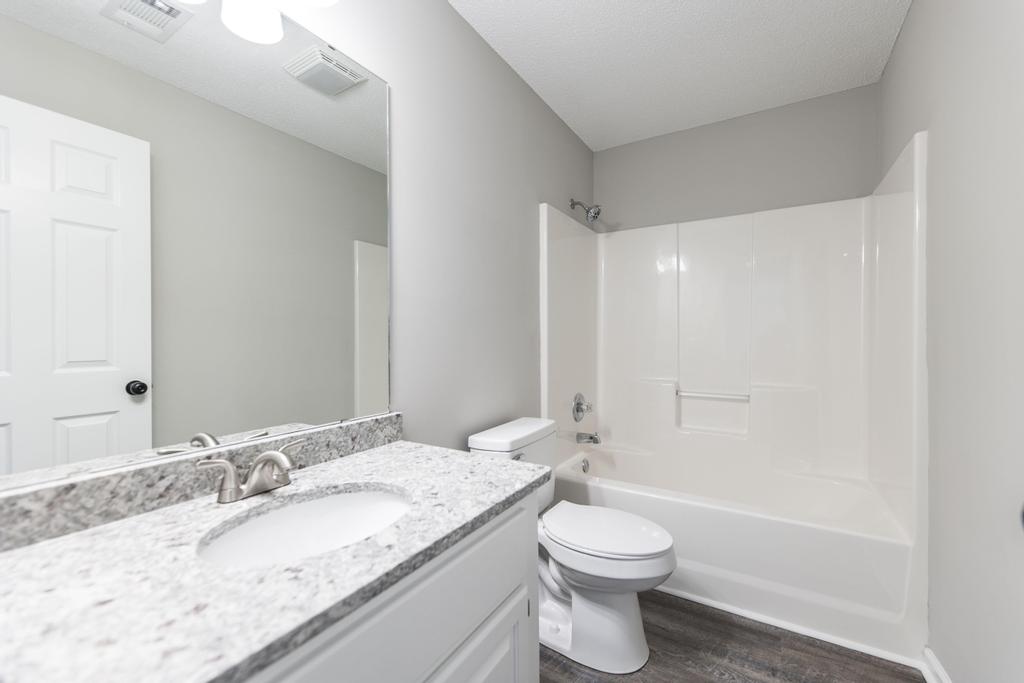 We buy houses in Kathleen GA. Renovated bathroom with new counter tops.