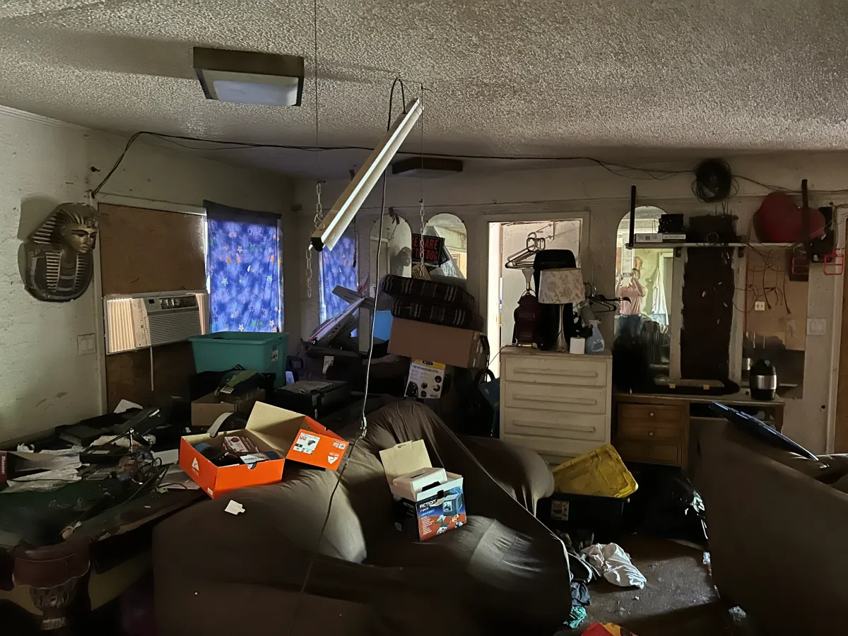 Tenant damaged house with stuff left behind.