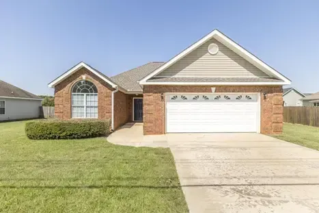 We Buy houses as is like this tenant occupied brick ranch with bay window and garage