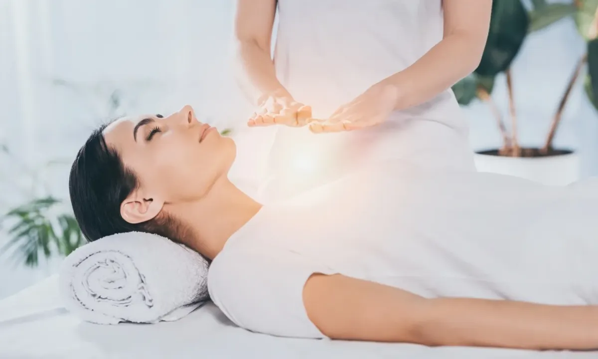 A practitioner performing Angelic Reiki to a client