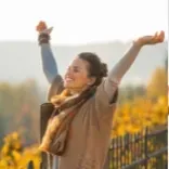 Woman feeling free after a Quantum Regression and Integration Therapy session.