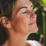 Woman having a calm mind and body following a Quantum Regression and Integration Therapy session.