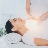 Client balancing and realigning her energy field with the help of Reiki and Theta Healing during a Q-RIT session.