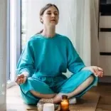 Client doing breathwork in a Quantum Regression and Integration Therapy session.