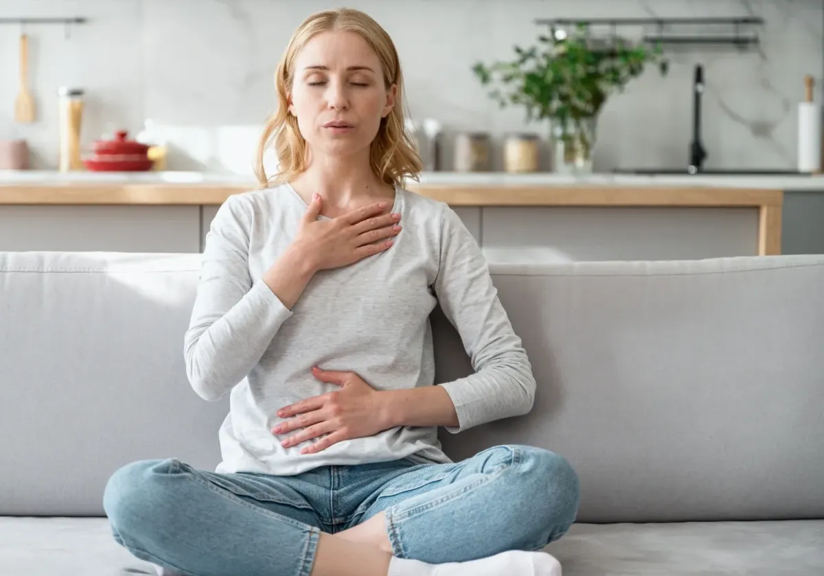 Client performing breathwork in a Q-RIT session.