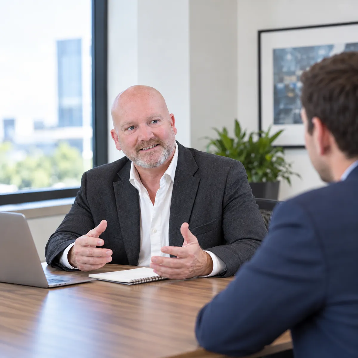 Oliver Johnson discussing business priorities with an SME owner
