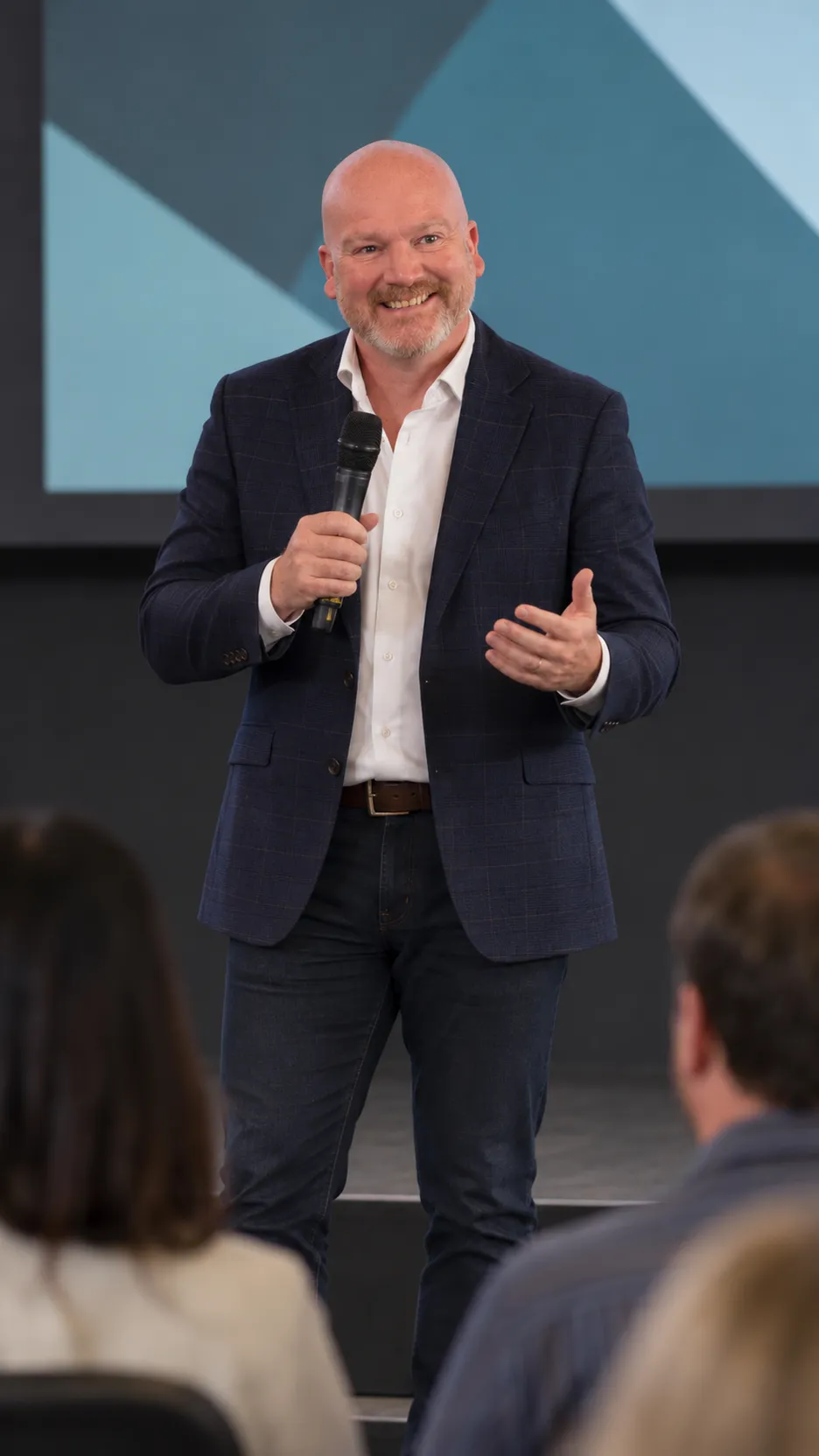 Oliver Johnson delivering a practical business keynote to a UK audience