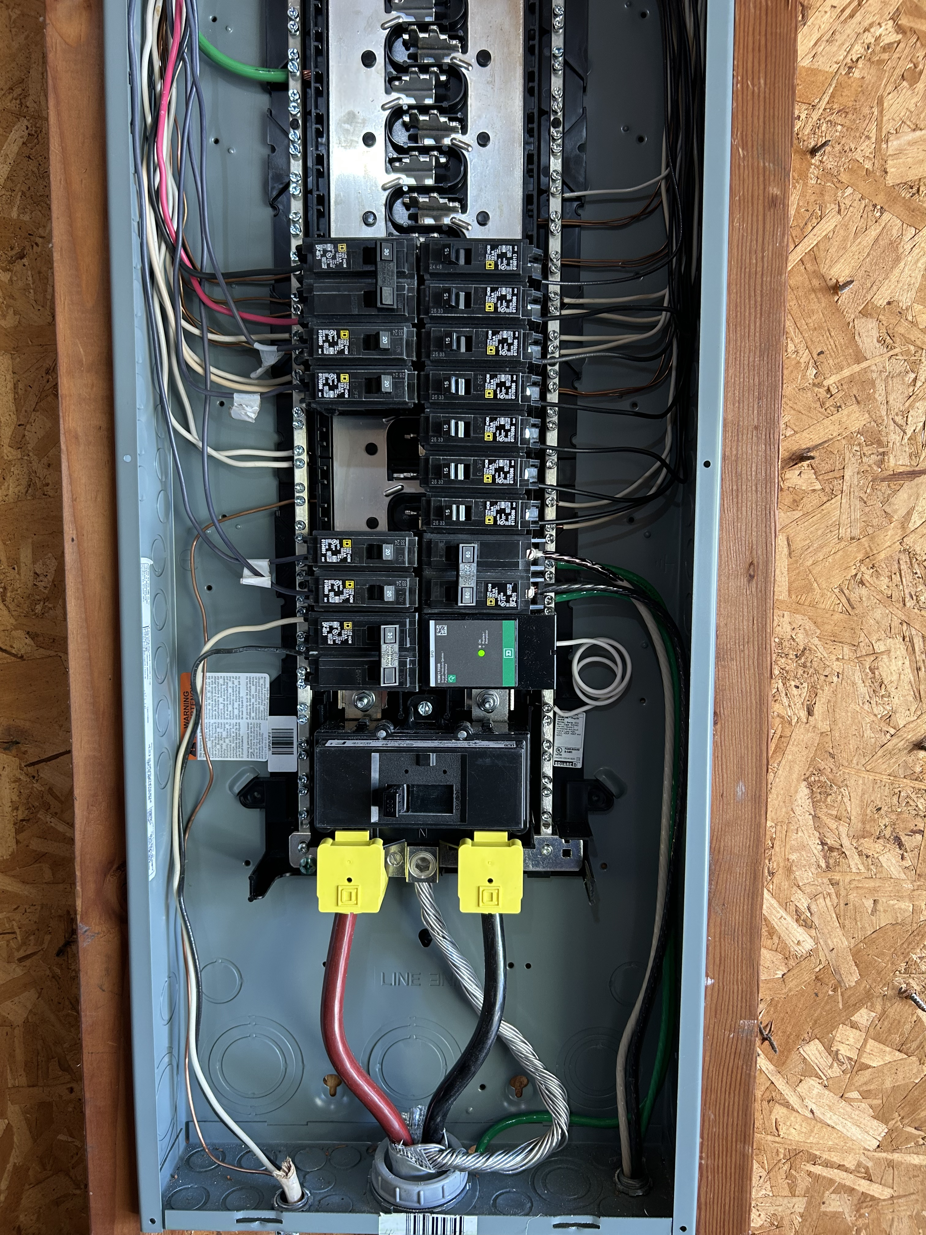 man in black shirt wearing white cap holding clear glass lamp