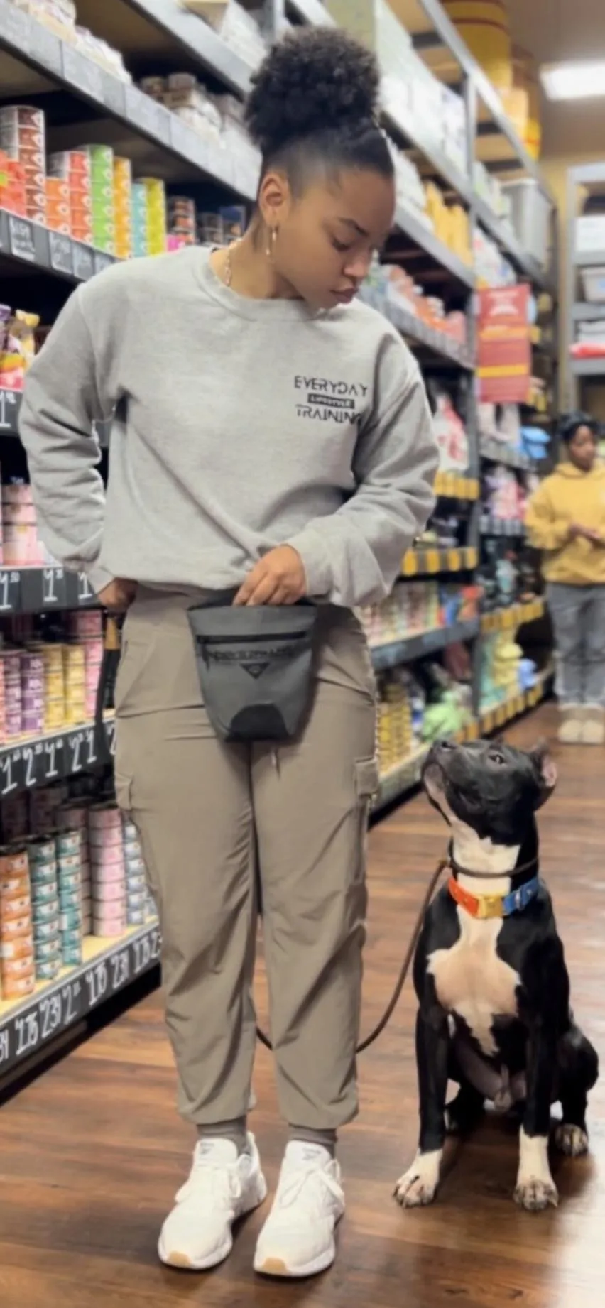dog trainer and dog in a store