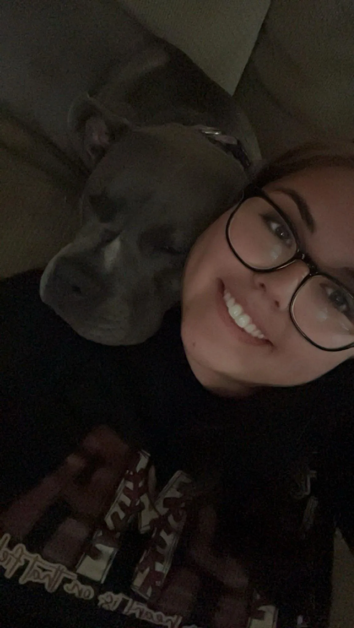 dog trainer cuddling with her personal dog