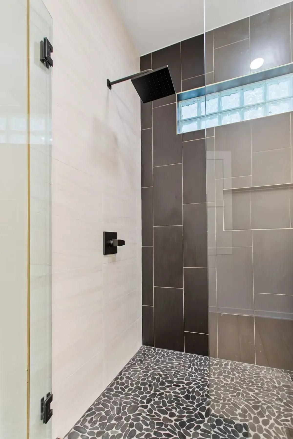 Tile shower remodel with rainfall showerhead