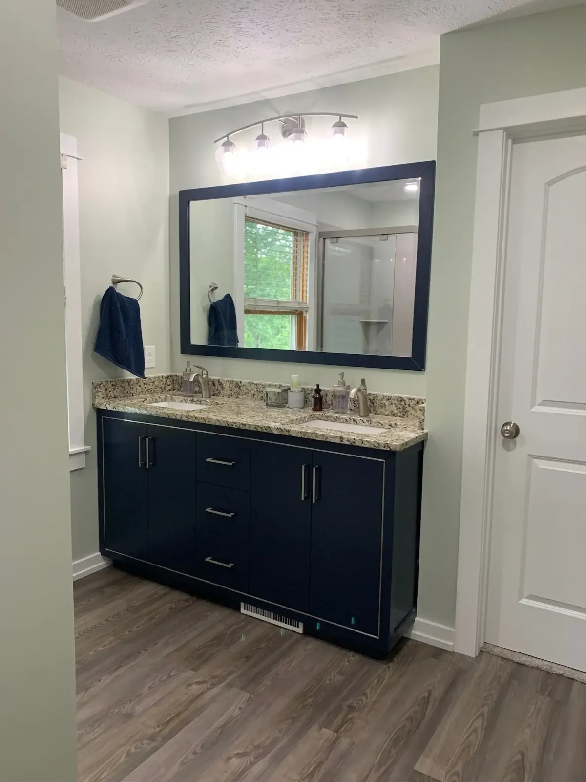 bathroom remodel with new flooring and lights