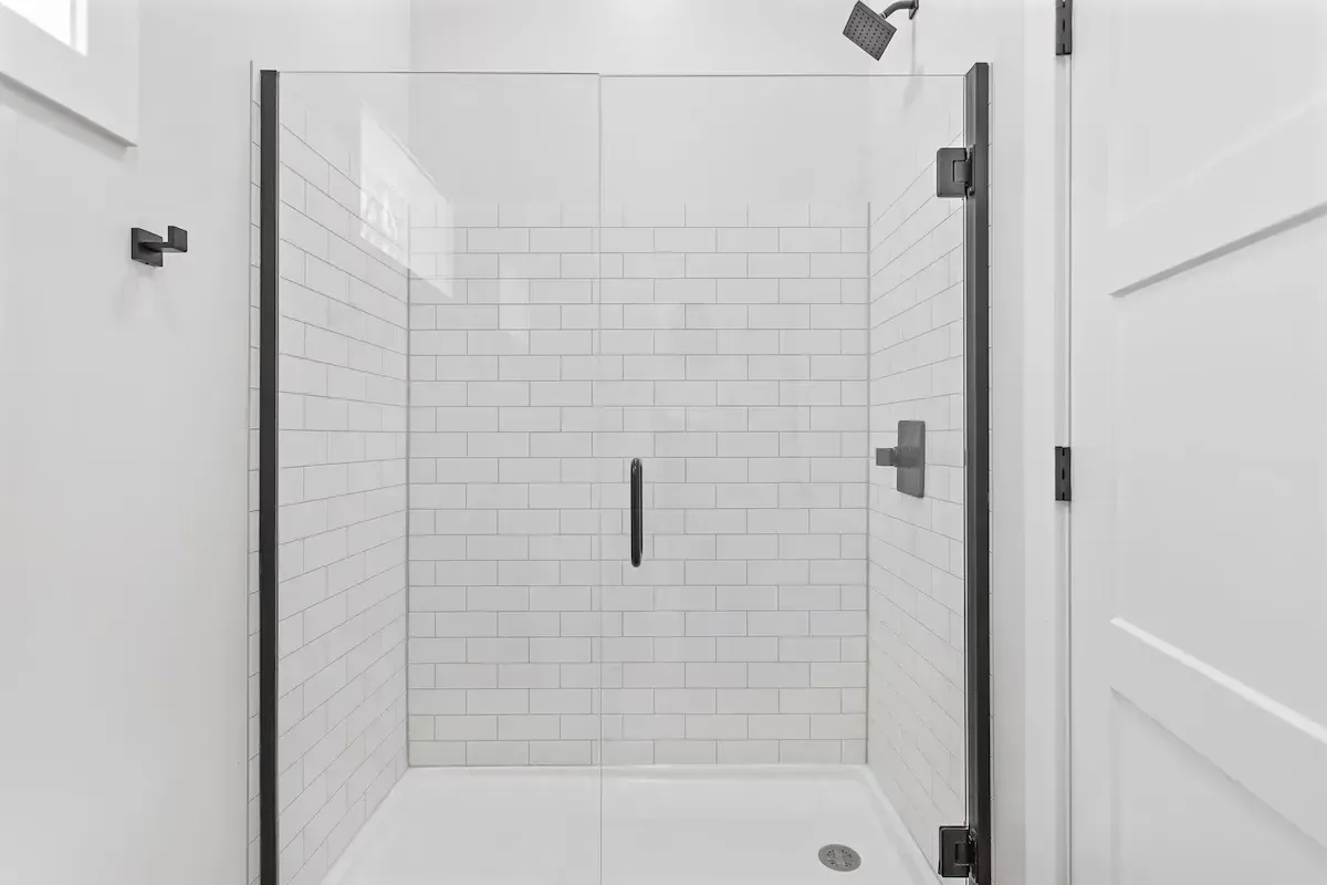 all white tile bathroom shower
