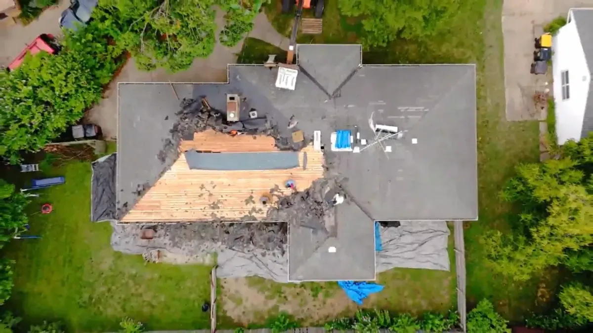 Removing old shingles on dated roof