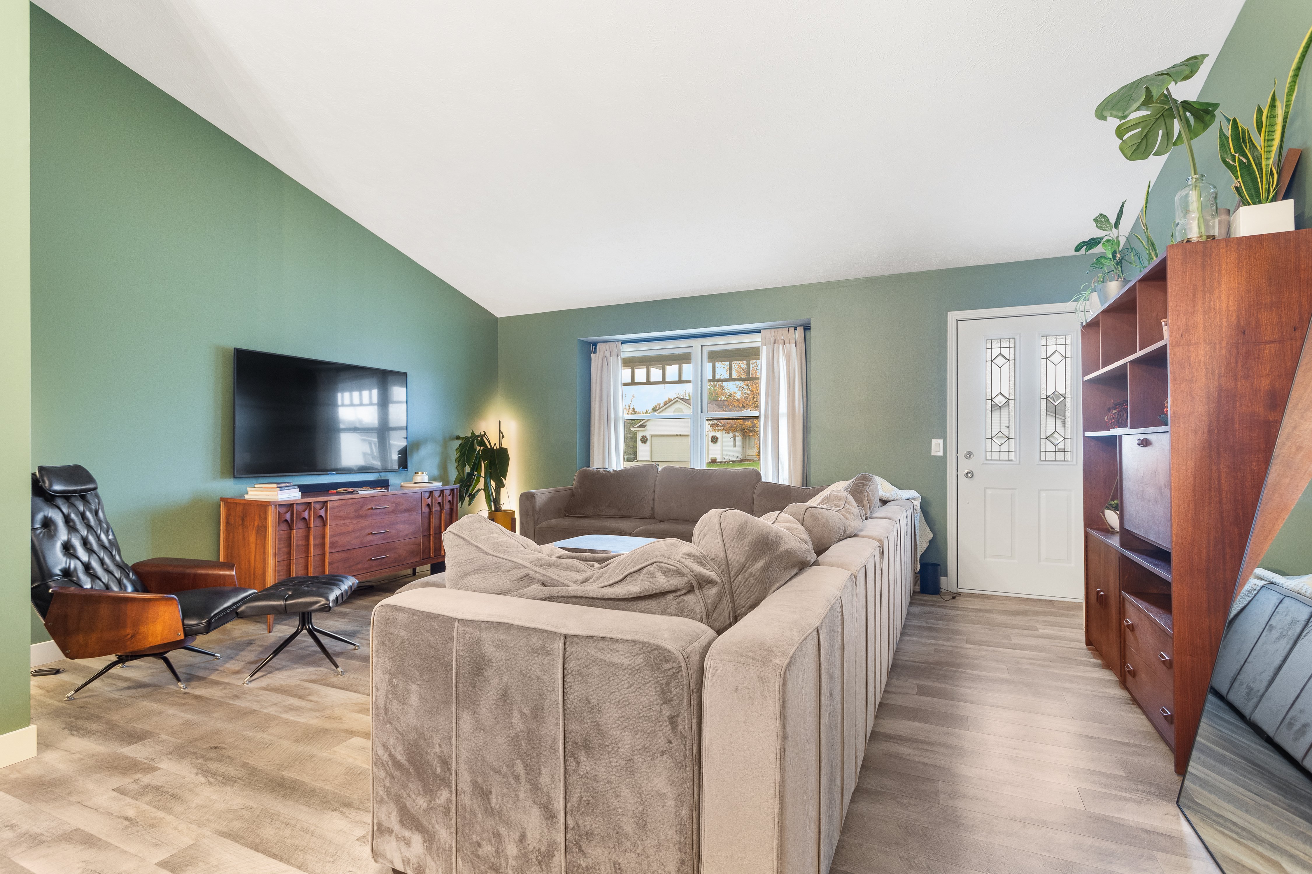 Living room remodel with new luxury vinyl plank flooring done by TPC Construction in Grand Rapids
