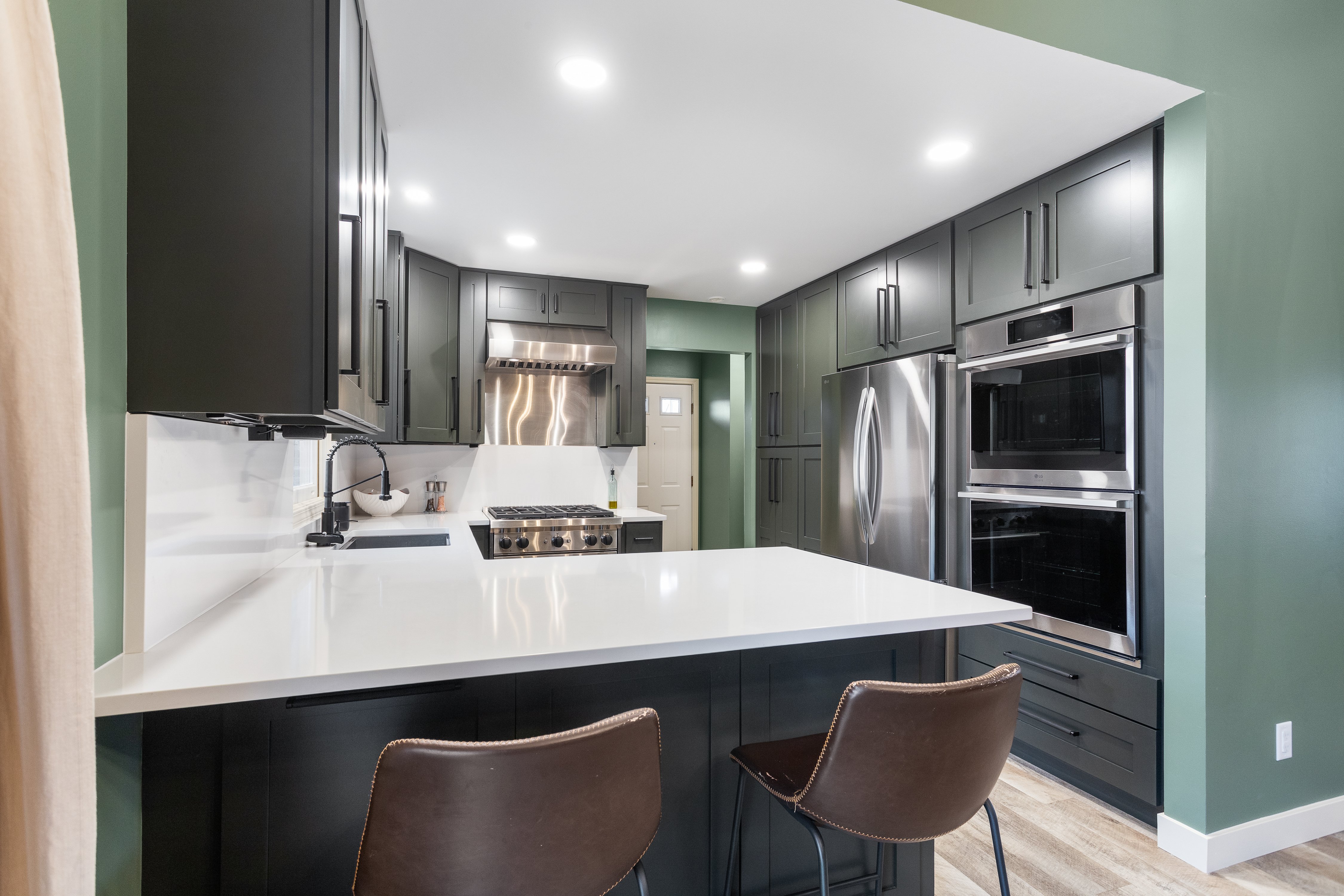 Full kitchen remodel with countertop bar seating and new appliances in Grand Rapids