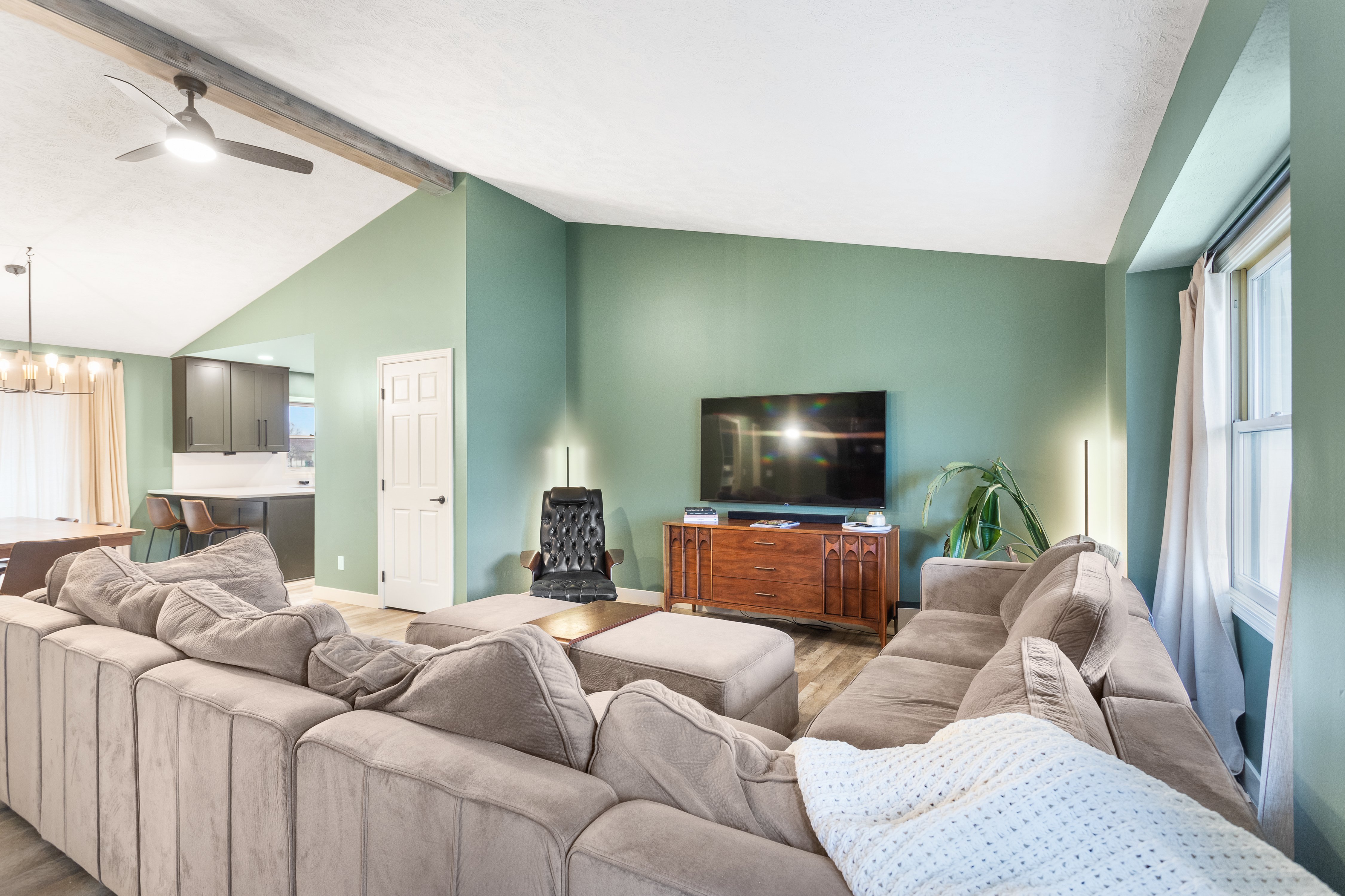 Full interior remodel with furnished living room and new flooring done by TPC Construction in Grand Rapids