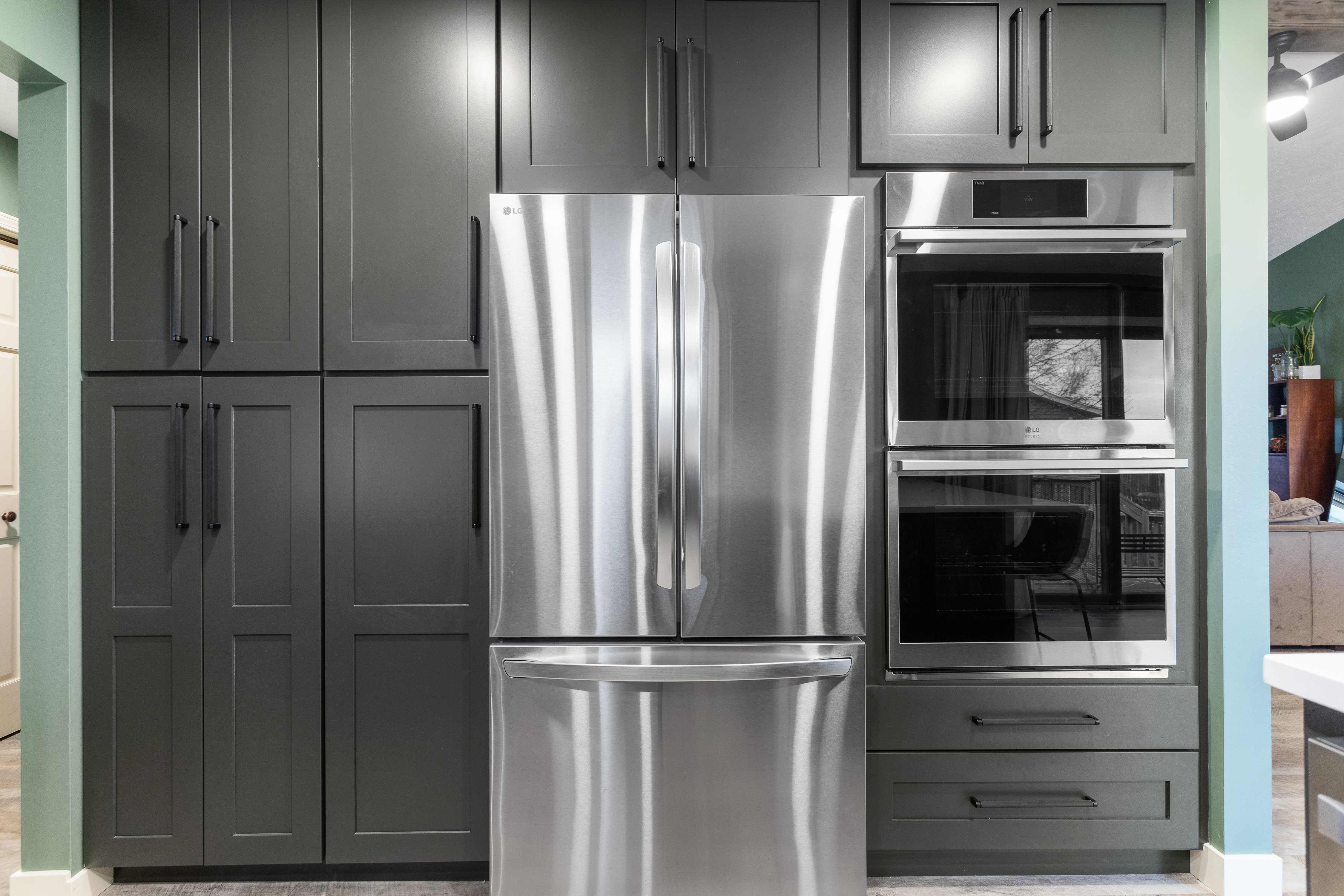 Dark wood cabinets and new appliances for kitchen remodel in Grand Rapids