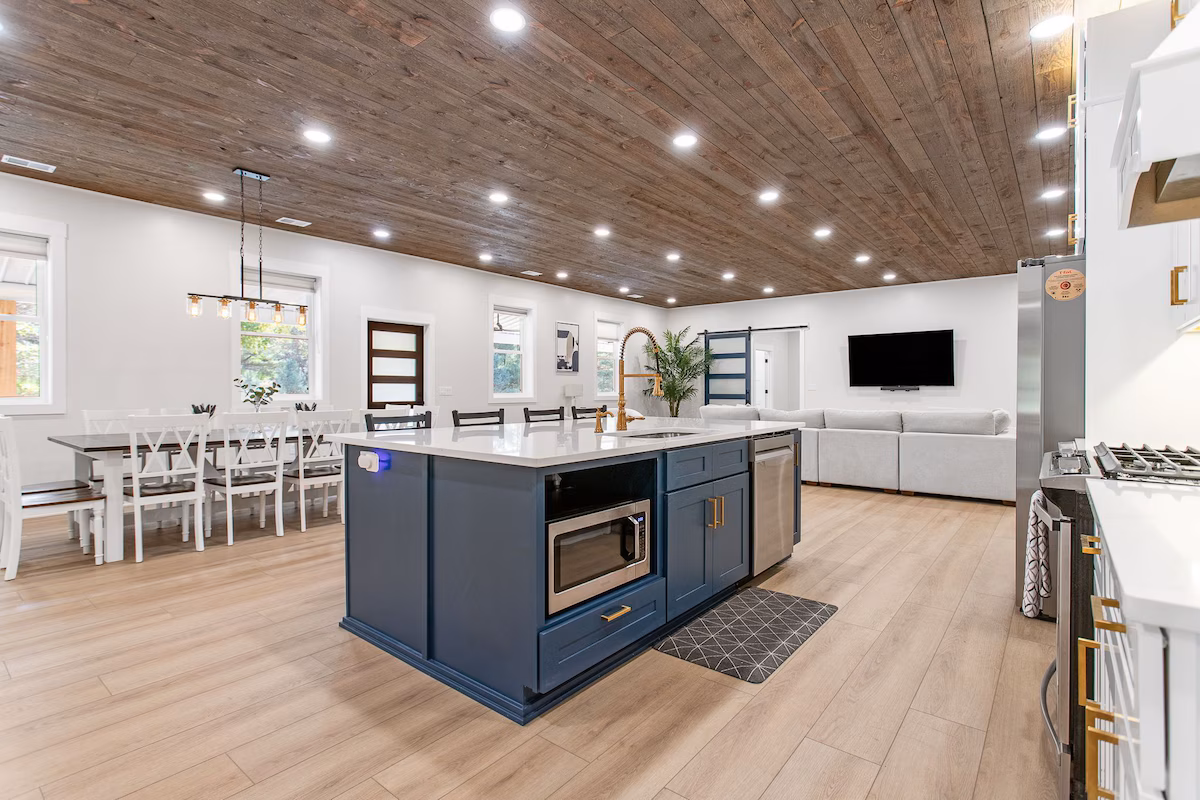 Open floor plan barndo with kitchen, dining area, and family room.