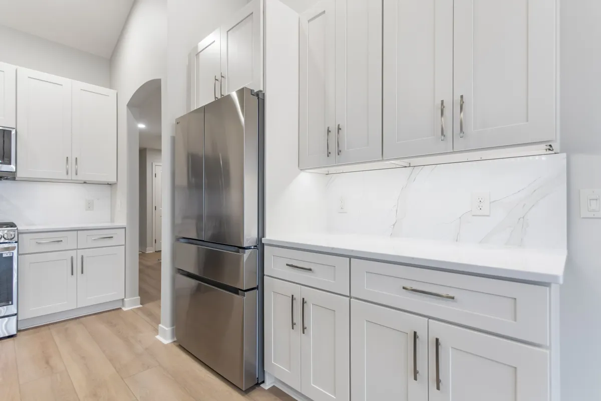 custom cabinets, lvp flooring, and new refrigerator 