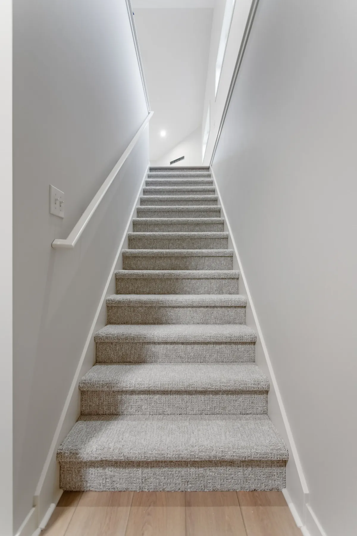 finished staircase with luxury plush carpet