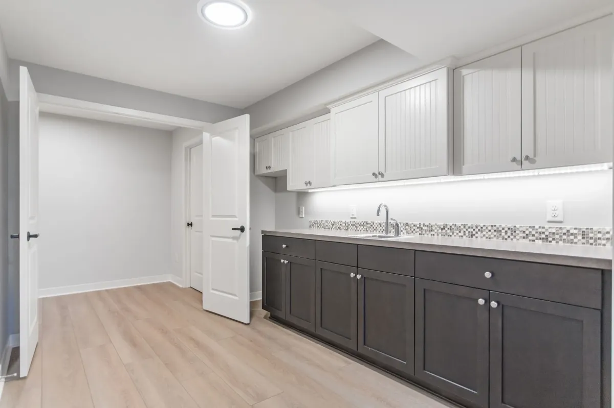 custom cabinets and wet bar in newly finished basement