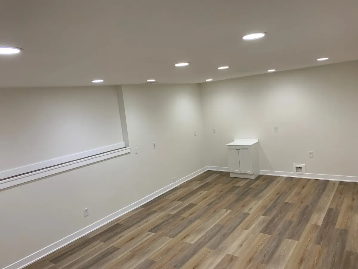 unfurnished basement remodel with hardwood flooring