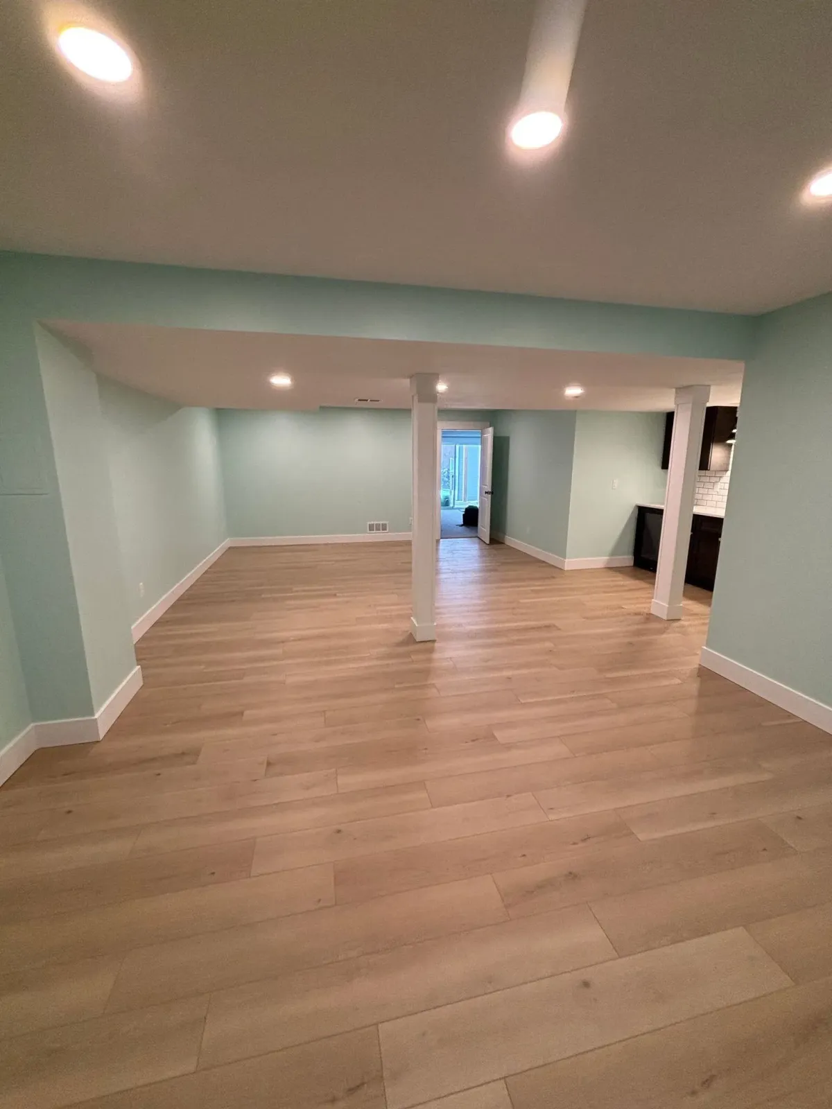 Unfurnished view of complete basement remodel