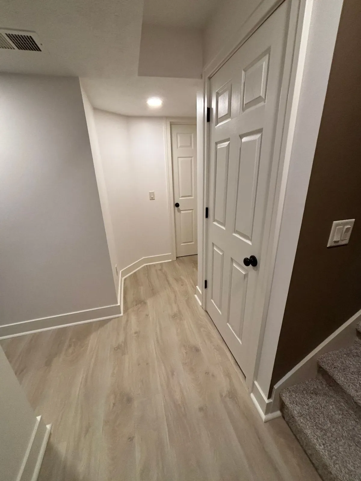 Full basement remodel stair landing and hallway