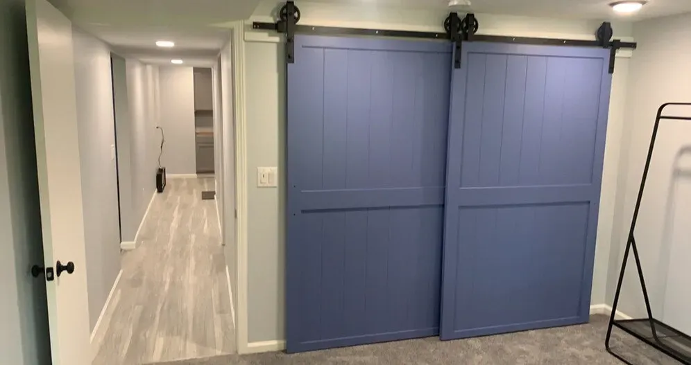 sliding barn doors in newly remodeled basement