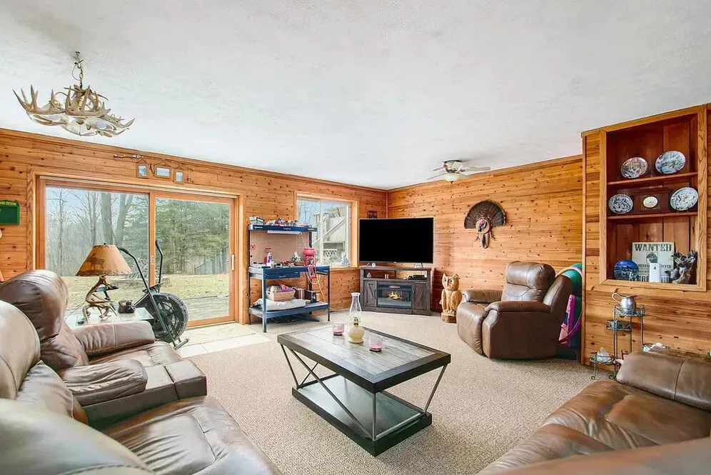 fully furnished basement remodel with natural wood walls
