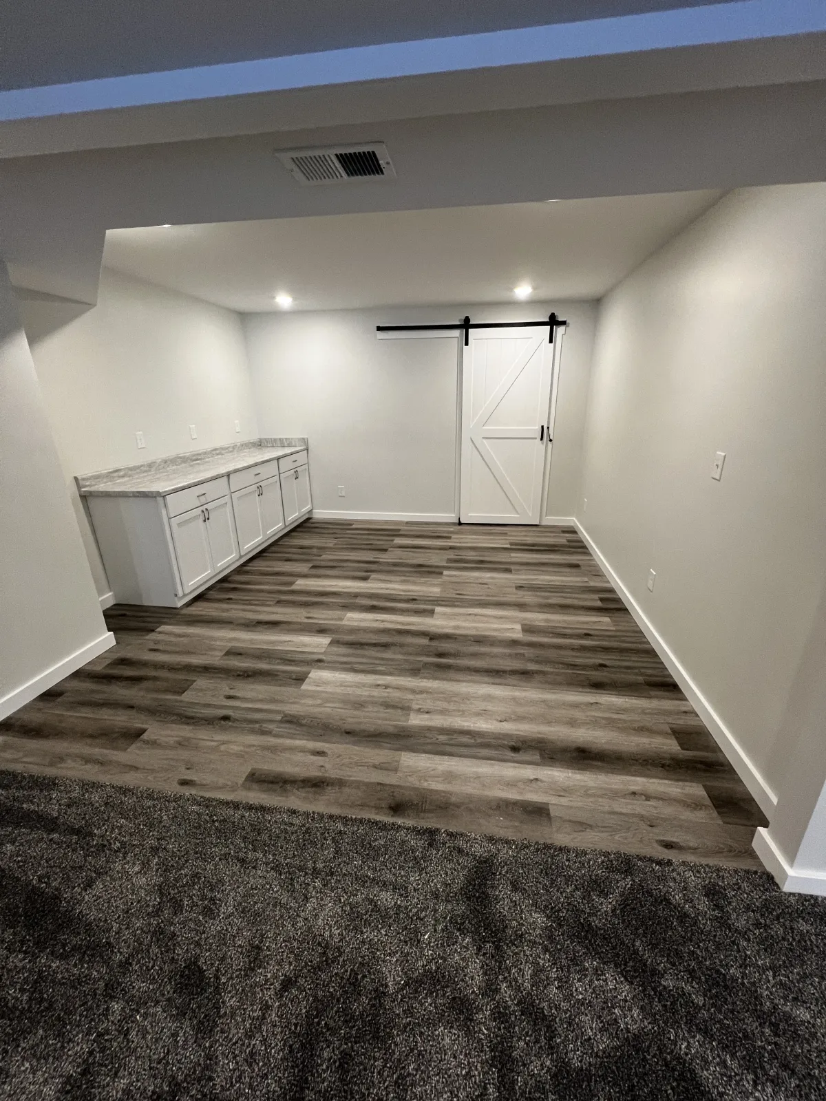 basement remodel with sliding doors