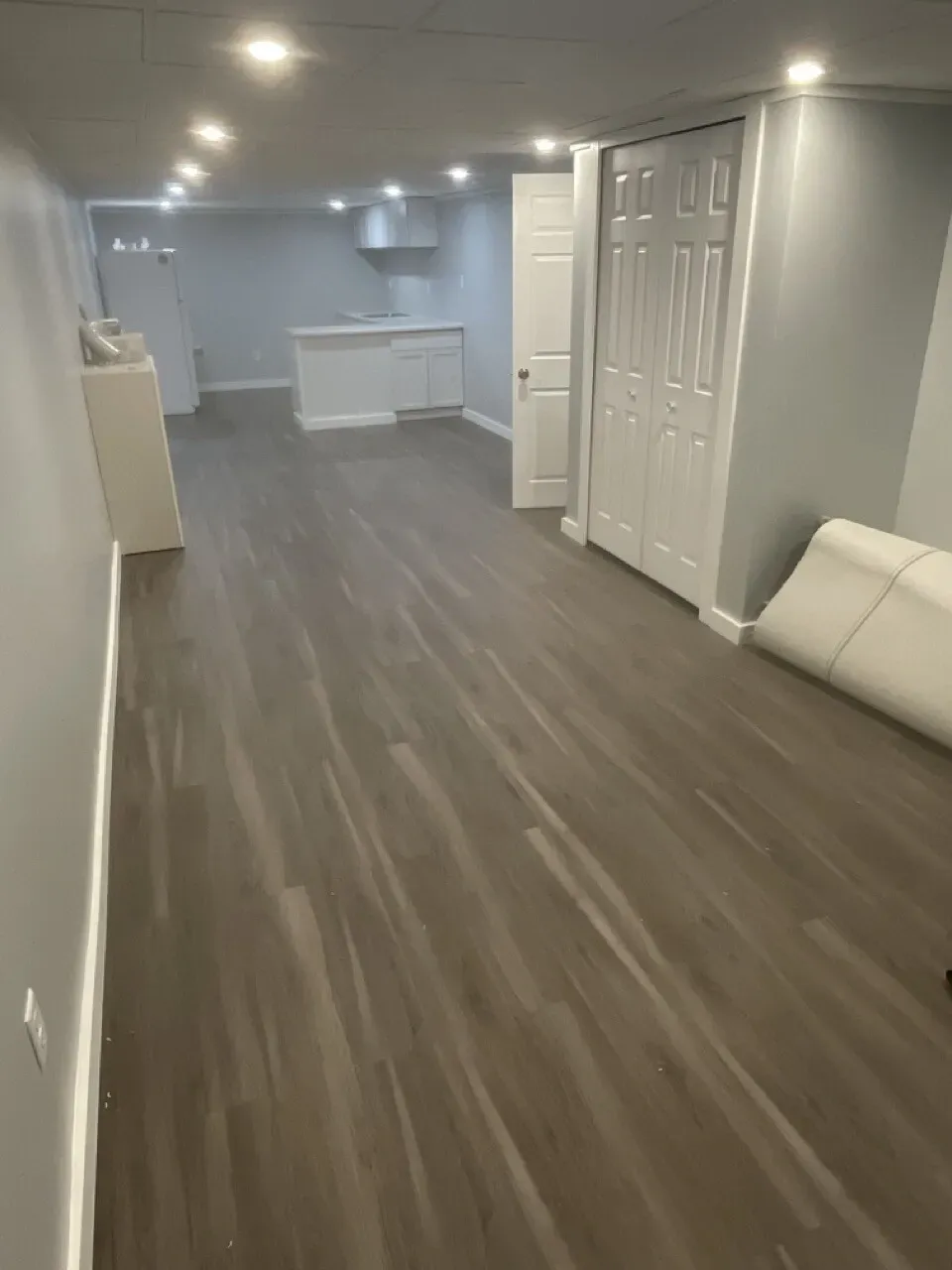 full basement remodel with hardwood flooring