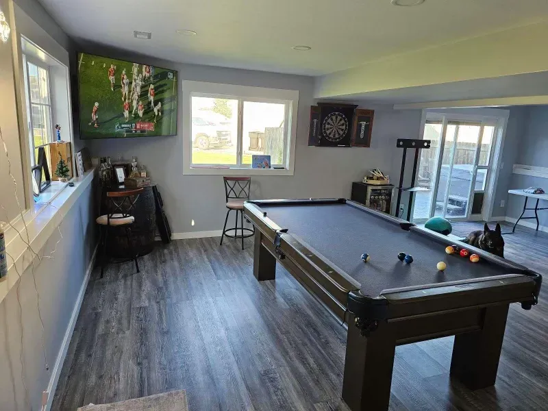 Furnished remodeled basement with poor table and back yard access