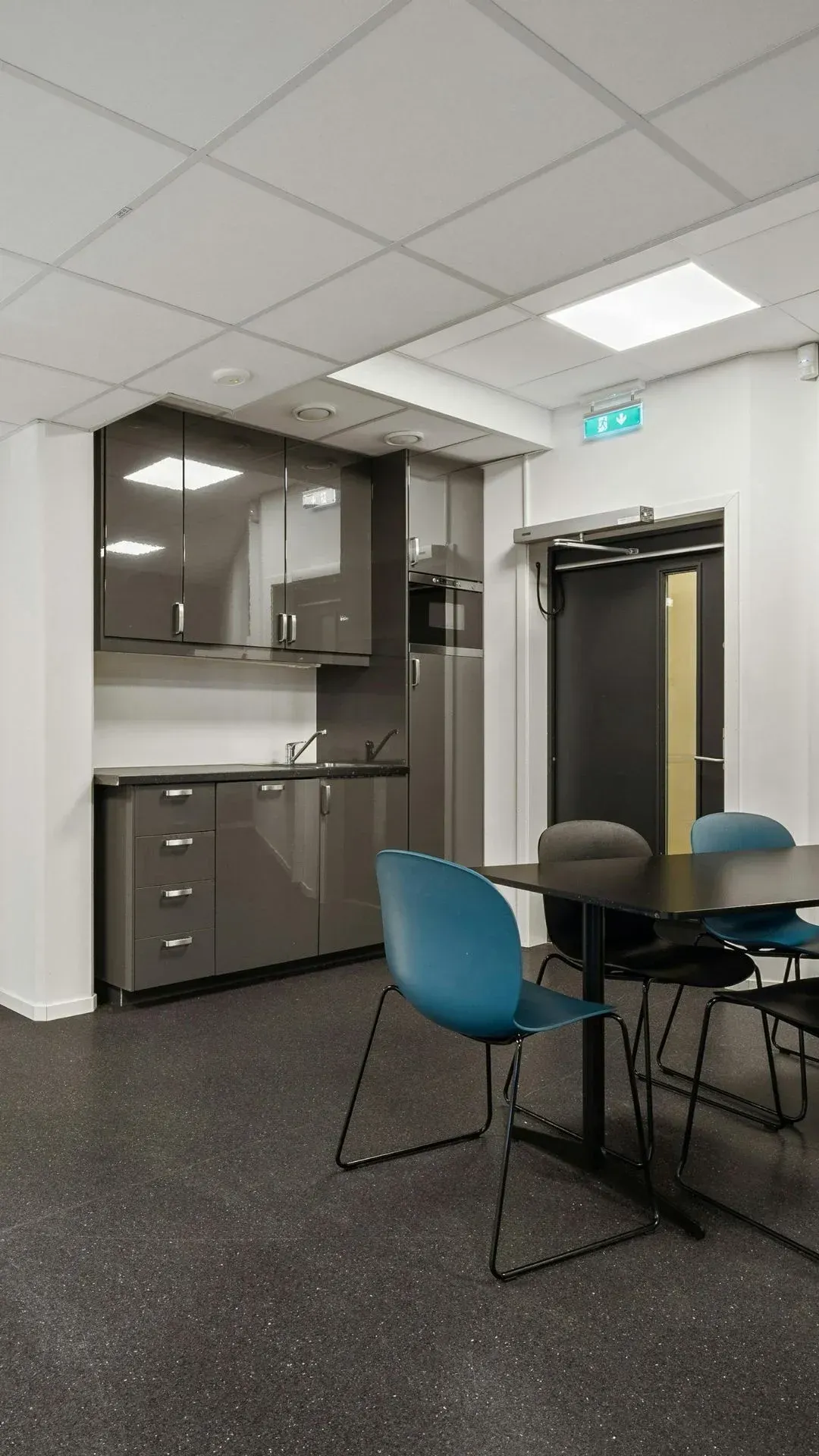 Modern commercial break room with kitchenette