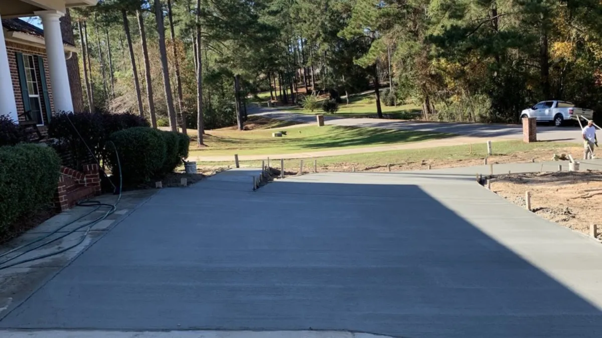 Jackson Concrete Pros levels sidewalk builds and installs driveways.