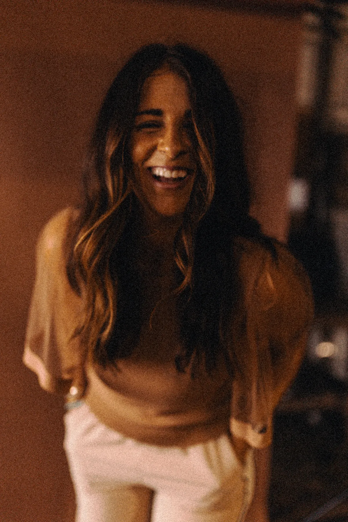 Kori from Coyote Brands laughing during a brand photo session