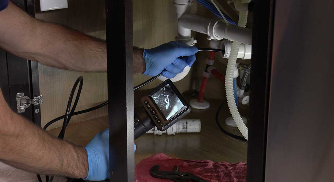 Professional drain cleaning with camera inspection by MH Plumbing in North Metro Minnesota